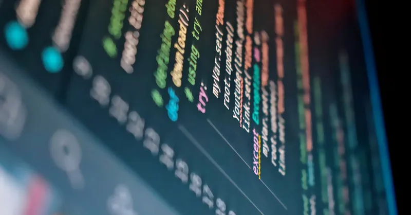 Vibrant close-up of a computer screen displaying color-coded programming code.